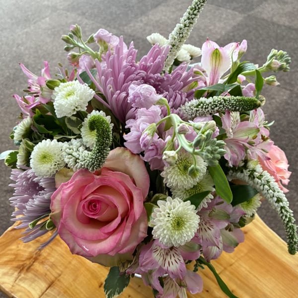 Pink rose and lavender mixed bouquet with white blooms in a vase