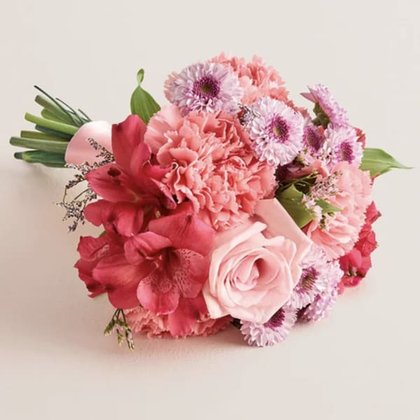 Pink bouquet with roses, carnations, and daisies
