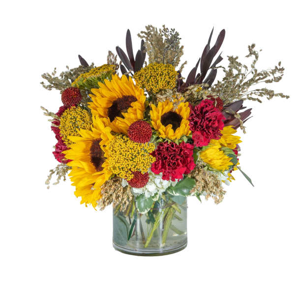 Sunflowers and red carnations in a glass vase