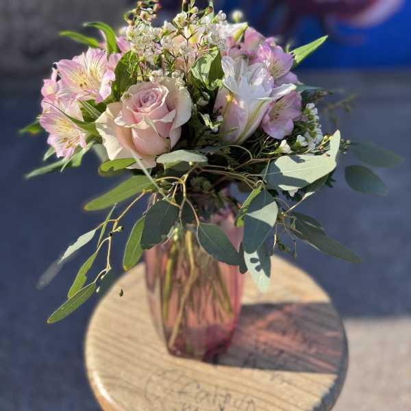 Pink and white bouquet in a glass vase