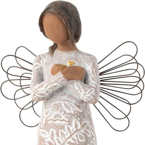 Angel figurine in a white patterned dress with wire wings