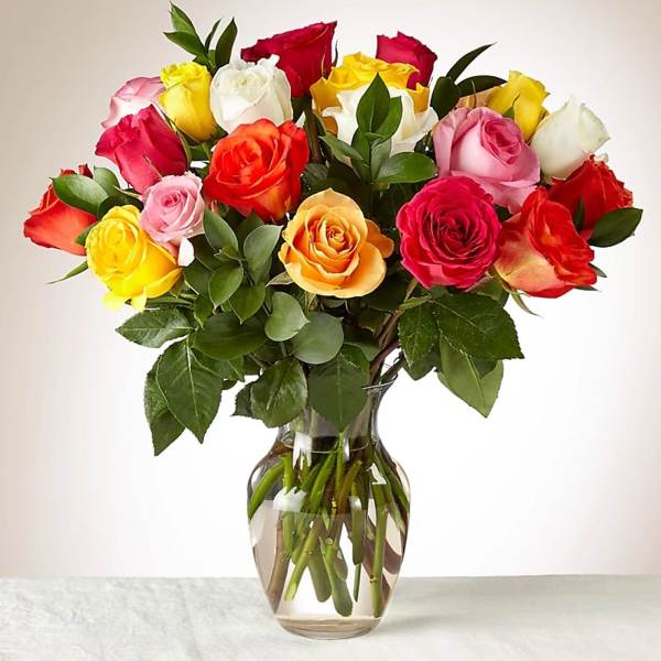 Mixed roses in a clear glass vase