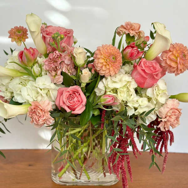 Pink and white mixed bouquet in a clear glass vase