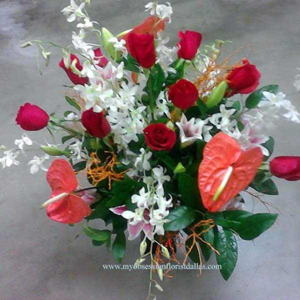 Bouquet of red roses, white orchids, and red anthuriums
