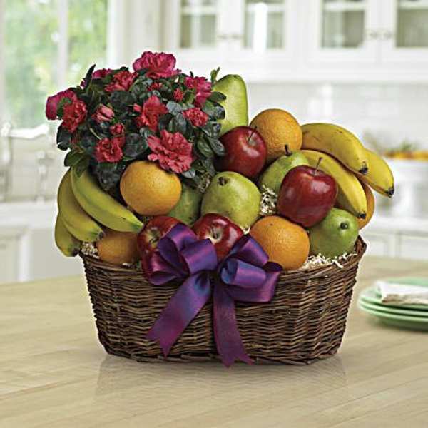 Fruit basket with flowers and a purple ribbon