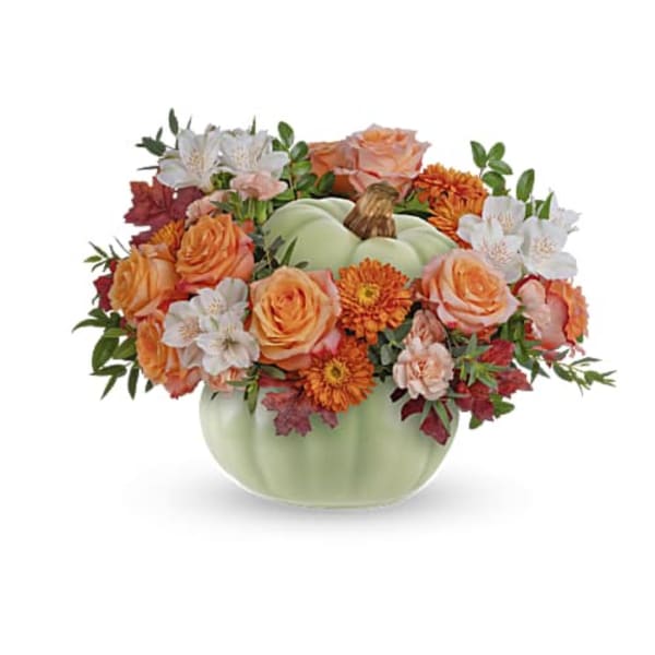 Pumpkin-shaped vase with orange and white flowers