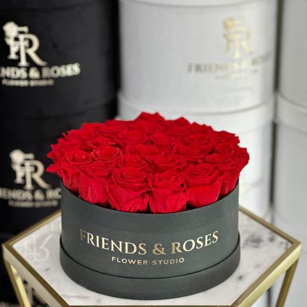 Round box filled with red roses