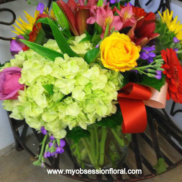 Colorful mixed bouquet with hydrangea, roses, and gerbera daisies