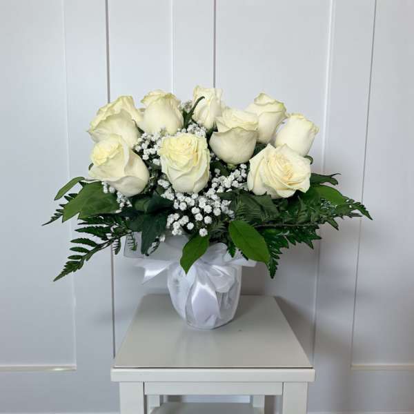 Dozen white roses in a vase