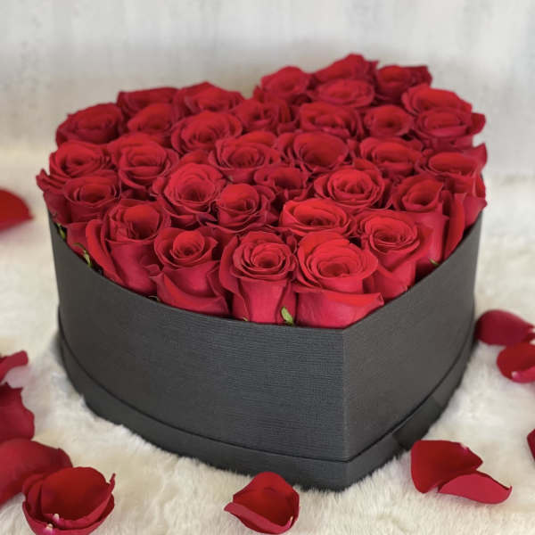 Heart-shaped box filled with red roses