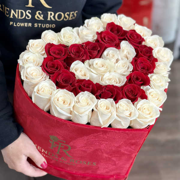 Heart-shaped box of red and white roses