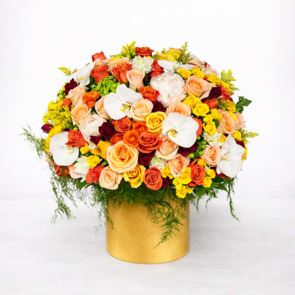 Mixed bouquet of roses and white orchids in a gold box