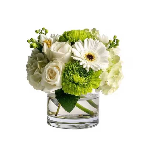White and green flower arrangement in a clear glass vase