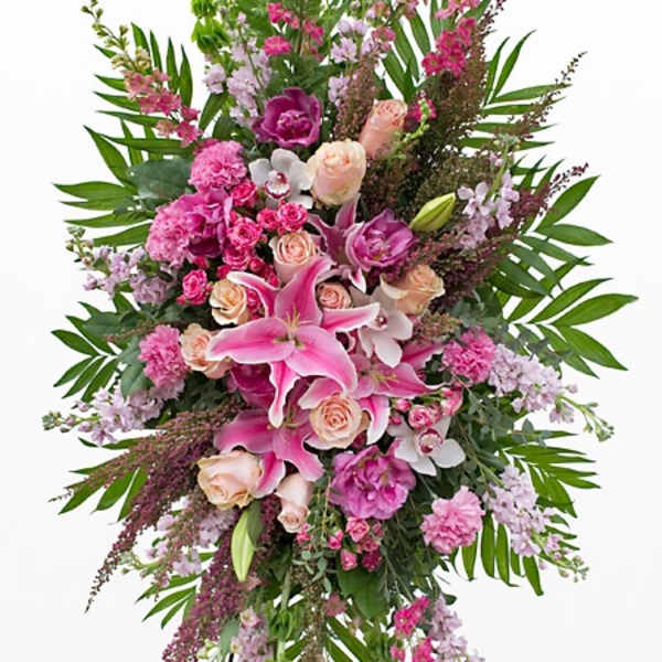 Tall pink and lavender floral spray with lilies and roses