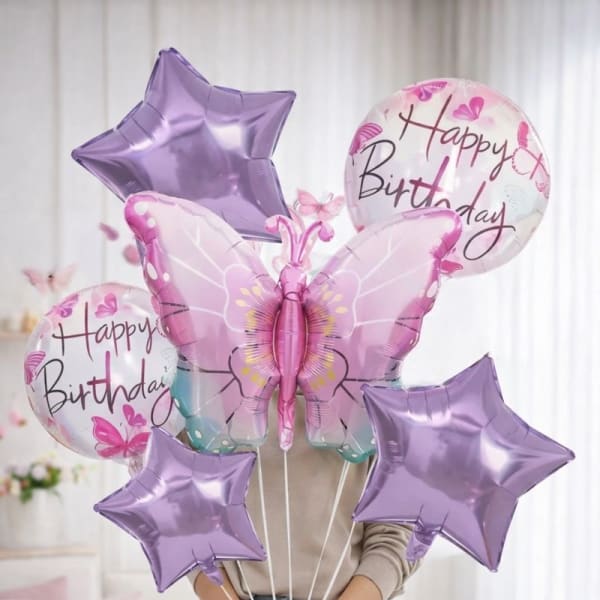 Birthday balloon bouquet with purple stars and a butterfly balloon