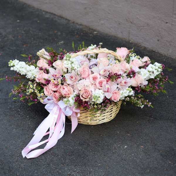 Pink and white flower basket with ribbon bow