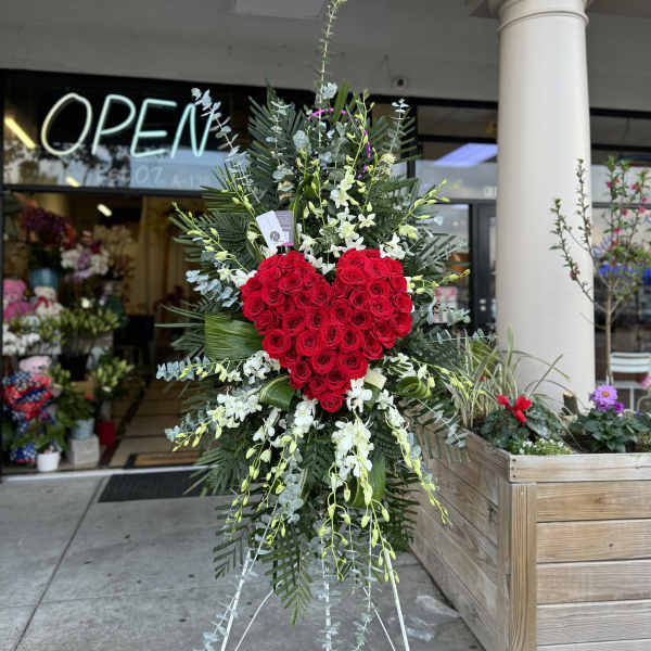 Standing floral spray with a red rose heart and white orchids