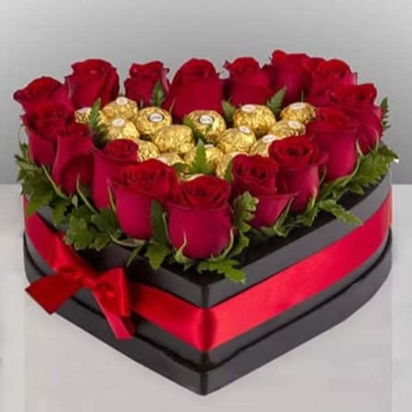 Heart-shaped box of red roses with gold-wrapped chocolates