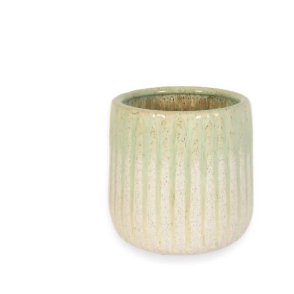 Small ribbed ceramic vase in pale green and cream