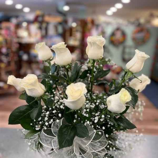 Bouquet of white roses with baby's breath and a sheer ribbon