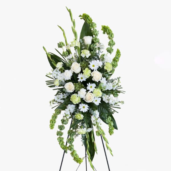 Tall white and green floral standing spray on an easel