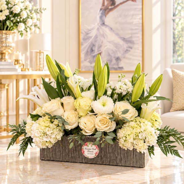 Cream and white floral arrangement in a rectangular wooden box