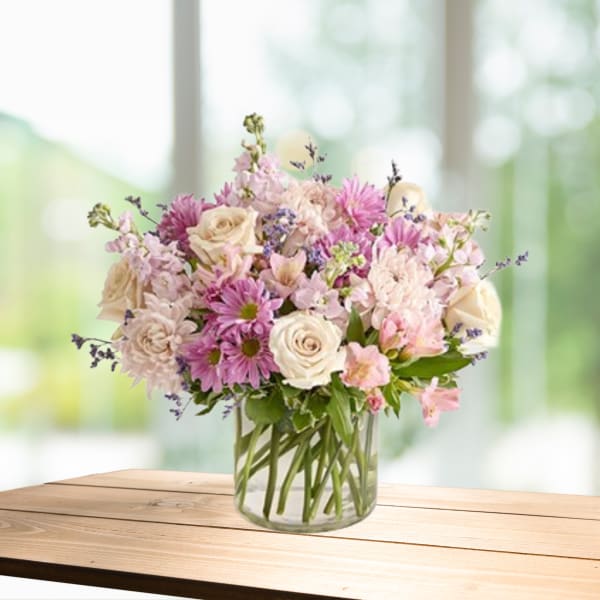 Pink and white mixed bouquet in a clear glass vase