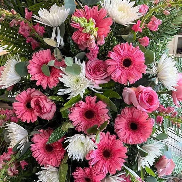 Pink and white mixed flower arrangement with gerbera daisies and roses