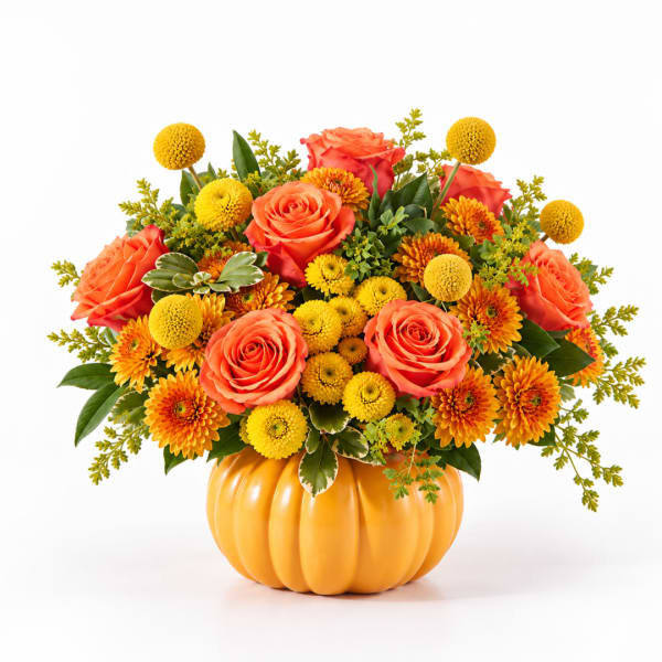 Orange roses and yellow mums arranged in a pumpkin-shaped vase