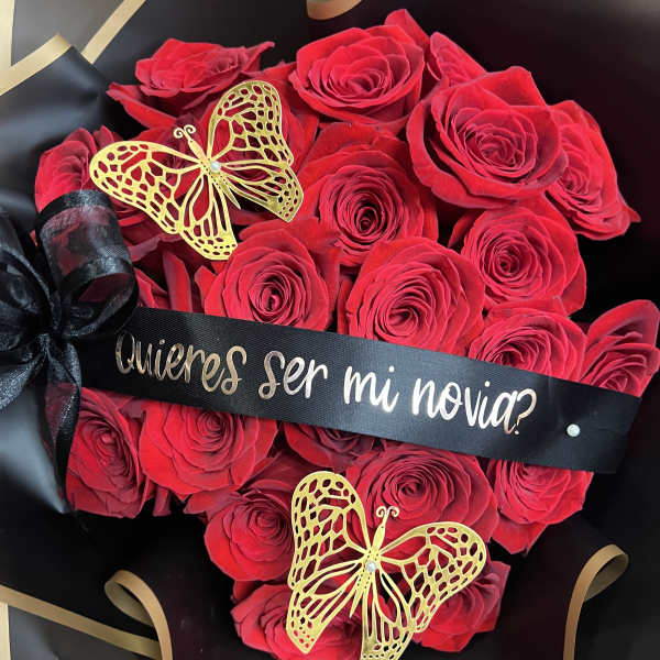 Red rose bouquet with black ribbon and gold butterfly decorations