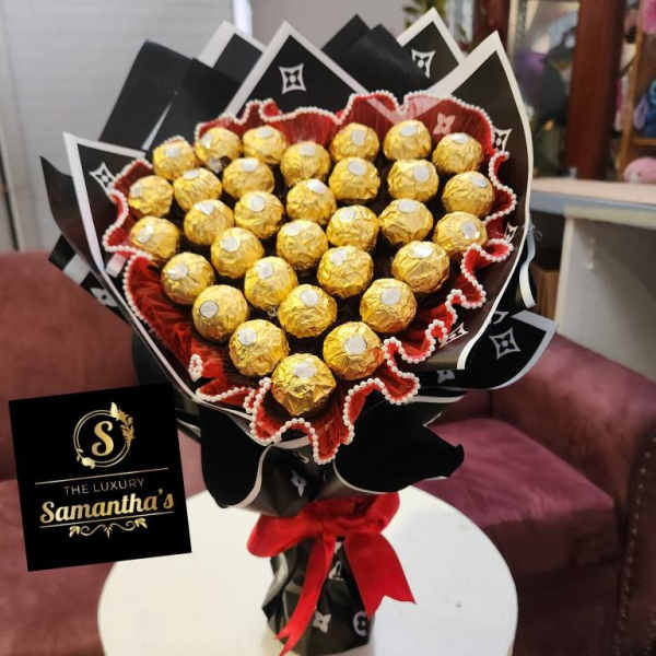 Bouquet of gold-wrapped chocolates with black and red wrapping