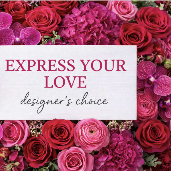 Pink and red roses with orchids around a love message card