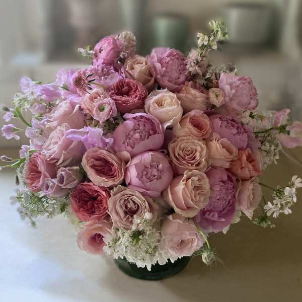 Pink and blush rose bouquet in a low vase