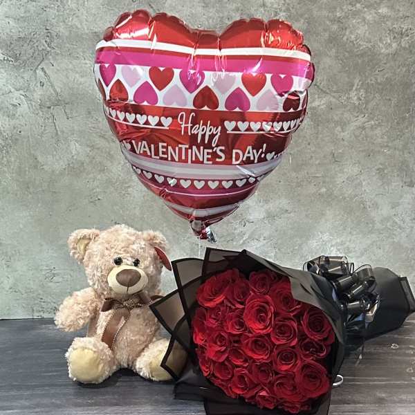 Red rose bouquet with a teddy bear and heart-shaped Valentine balloon