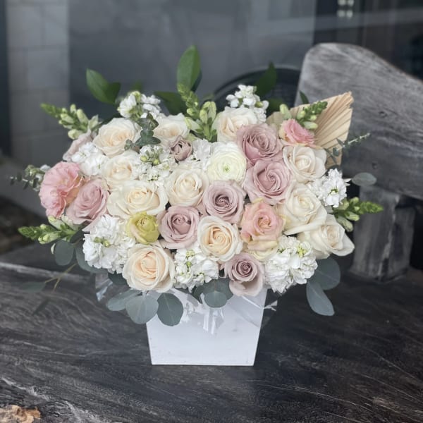 Blush and ivory rose bouquet in a white box vase