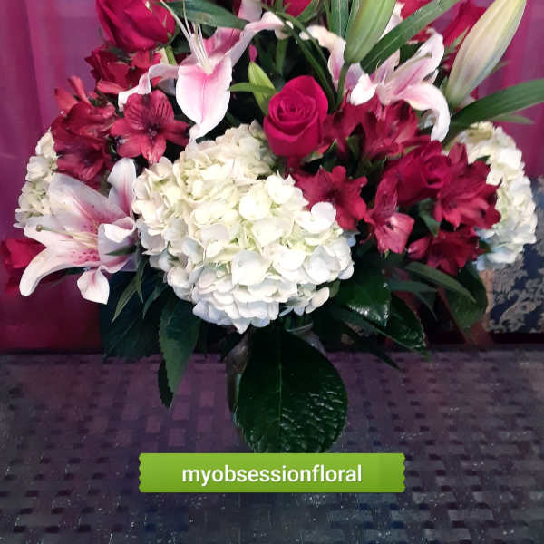 Bouquet of red roses, white lilies, and white hydrangea