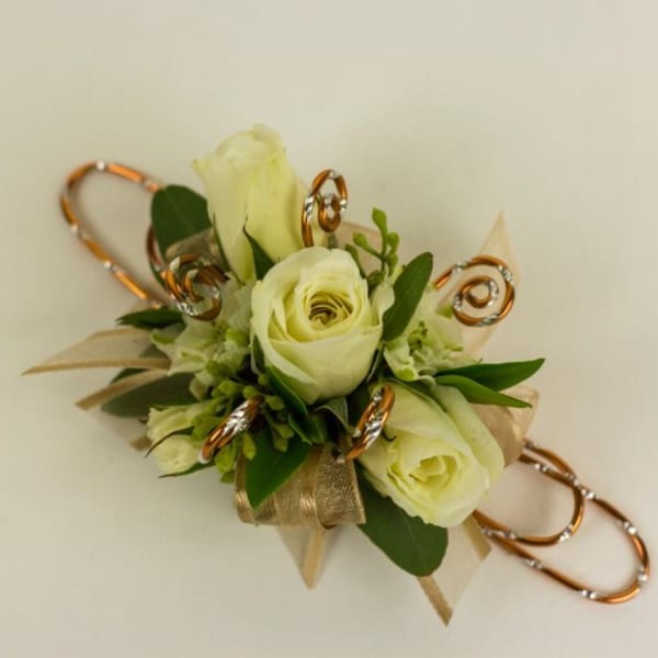 White rose corsage with gold ribbon and decorative loops