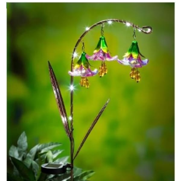 Decorative hanging flower-shaped lights on a curved metal stand