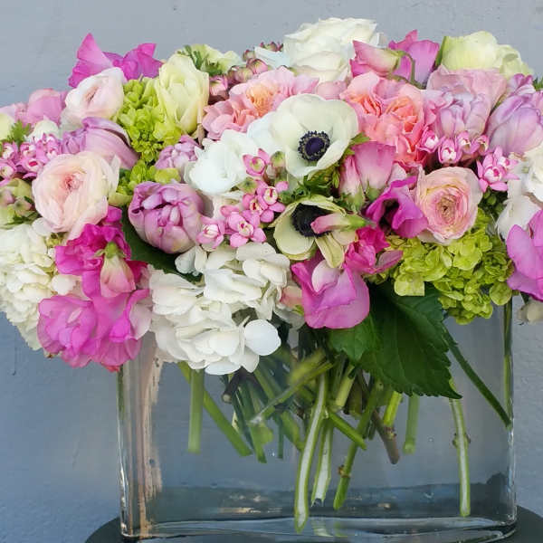 Pink and white mixed bouquet in a clear glass vase