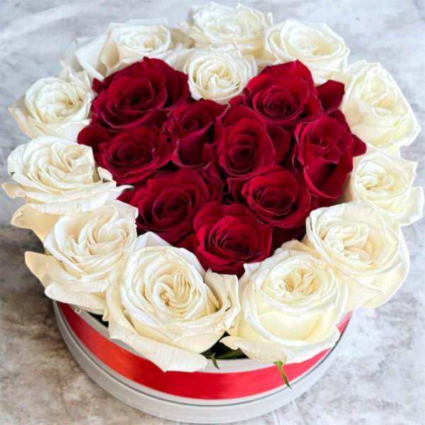 Heart-shaped box of red and white roses