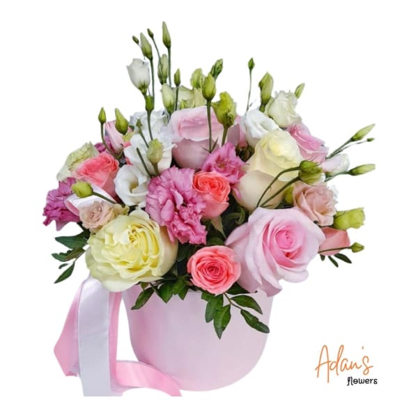 Pink and white rose bouquet in a pastel pink hatbox with ribbon