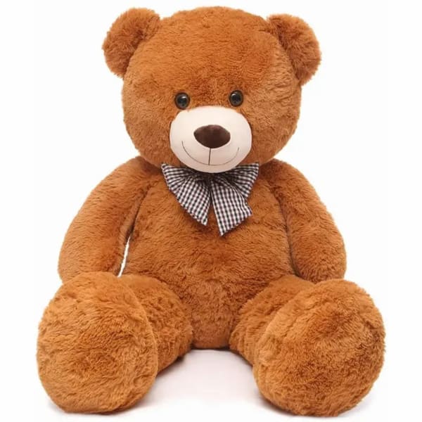 Brown teddy bear with a checkered bow tie on a white background