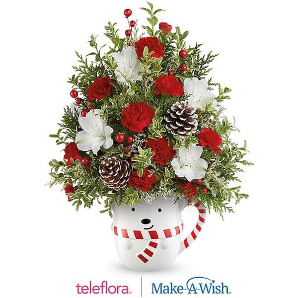 Christmas bouquet in a snowman mug with red and white flowers