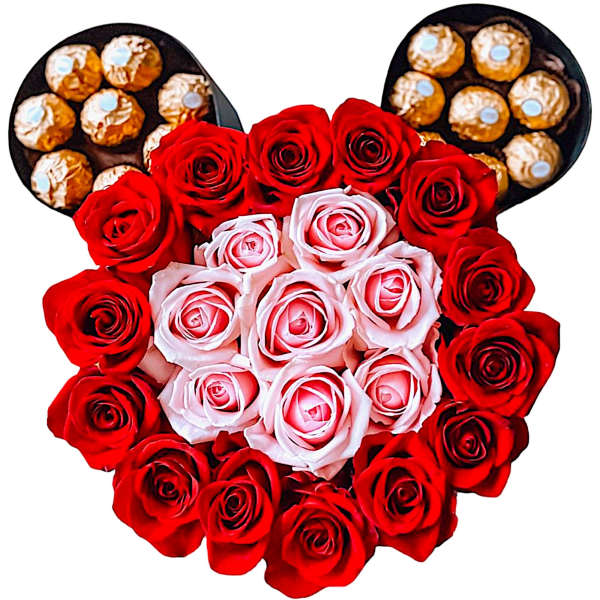 Heart-shaped rose arrangement with chocolates at the top