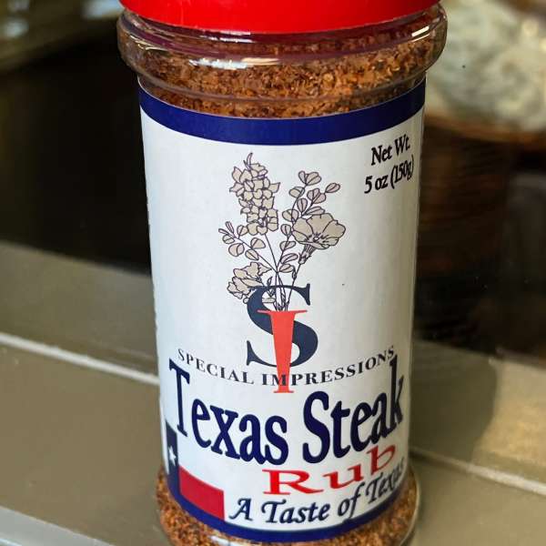 Jar of Texas Steak Rub seasoning with a red lid