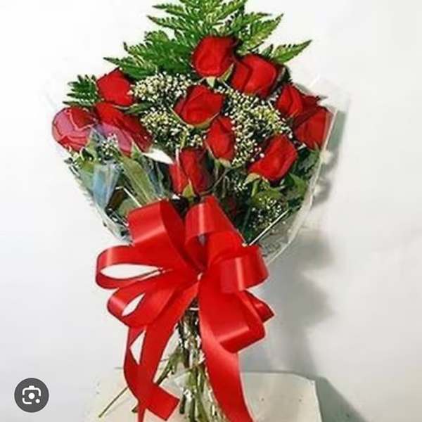 Bouquet of red roses wrapped with a large red ribbon