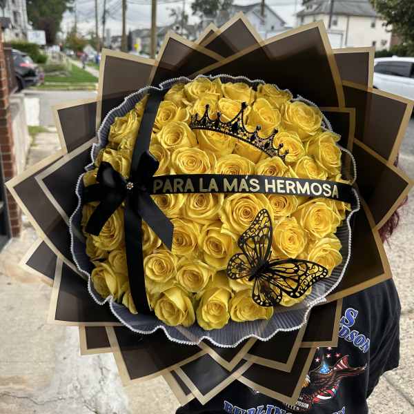 Large bouquet of yellow roses with a black ribbon and butterfly decoration