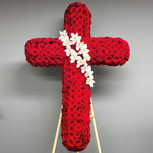 Red rose cross with white orchids on an easel