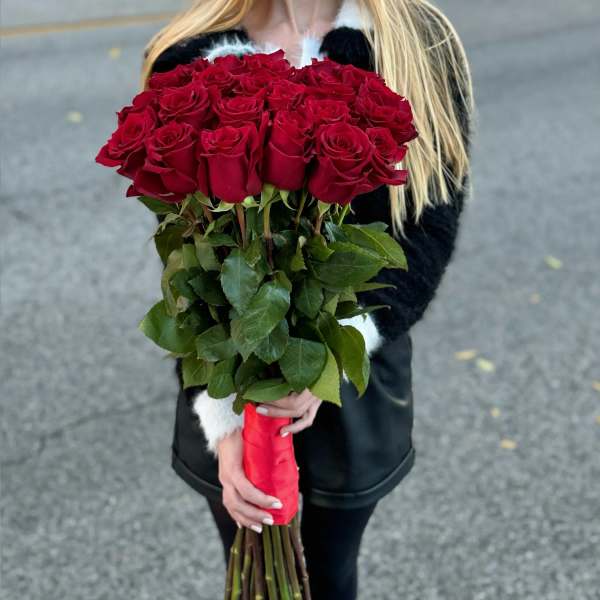 Large bouquet of red roses with a red ribbon wrap