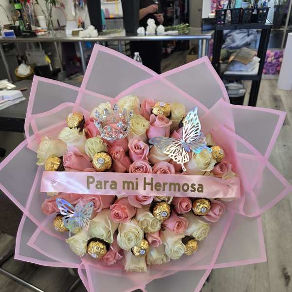 Pink and cream rose bouquet with chocolates and butterfly decorations